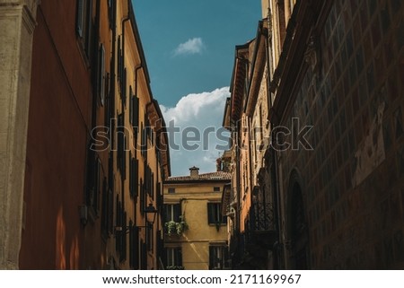 Beautiful old buildings on Verona street, Italy. Amazing blue sky. Selective focus.