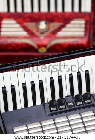 Detail of red and black piano accordion