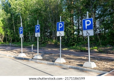 Parking signs for people with disabilities in the park