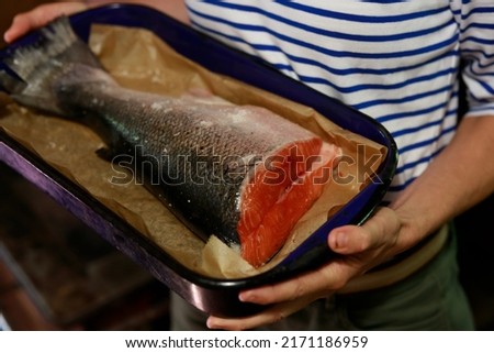Raw Salmon Tail in a baking Dish Ready to be Put in the Oven