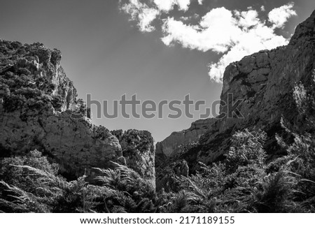 black and white picture of two mountains and the sky