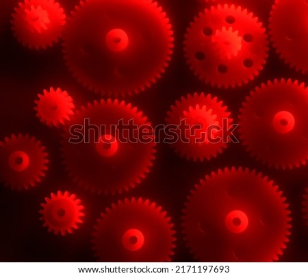 Plastic gears compilation on a red background. Spare parts for your RC toy. Background picture.