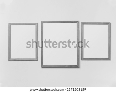 Interior poster mock up with vertical empty wooden frame. 3D rendering.