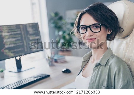 Photo of charming intelligent lady sitting chair near desktop monitor look camera daylight office