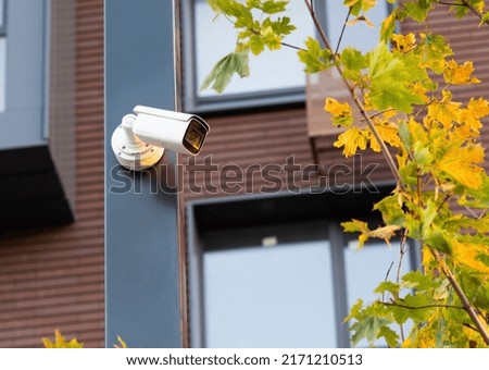 video surveillance installed on a pole, outdoor security.