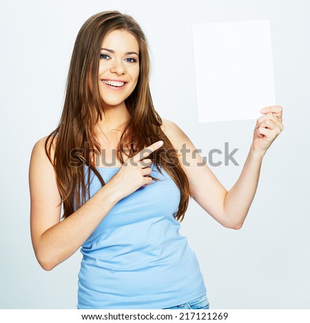 young woman hold white blank paper banner. Young smiling woman finger pointing on blank card.  isolated on white background.