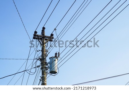 power pole, electric poles, power lines on a blue sky background