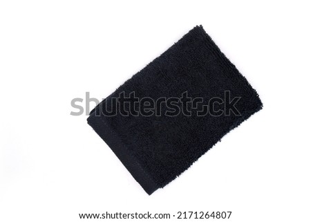 black makeup remover towel folded top view wash cloth isolated with white background Royalty-Free Stock Photo #2171264807