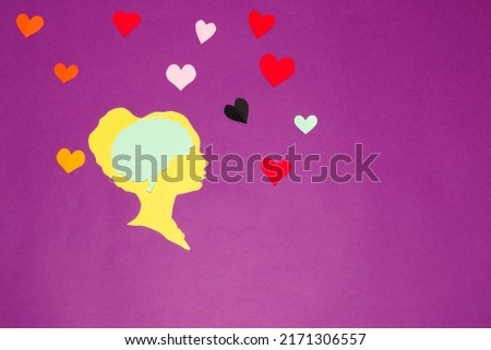 female paper head with brain, around her colorful paper heart, but she remains immune to the love around her and goes head through life, creative art design on purple background