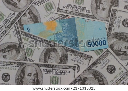 Conceptual Photo 50000 Rupiah Beyond dollar paper money, Flat Lay