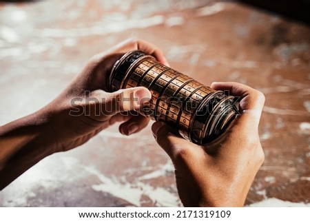 Brain teaser game, escape room, cryptic message hidden inside puzzle  Royalty-Free Stock Photo #2171319109