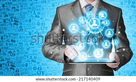Business man using tablet PC social connection