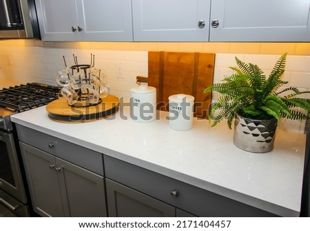 Kitchen Counter Top With Lazy Susan Of Glass Coffee Mugs Royalty-Free Stock Photo #2171404457