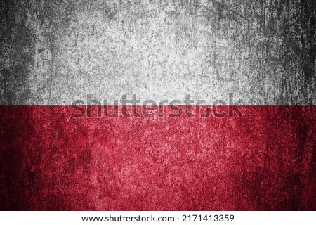 Closeup of grunge Polish flag. Dirty Poland flag on a metal surface.