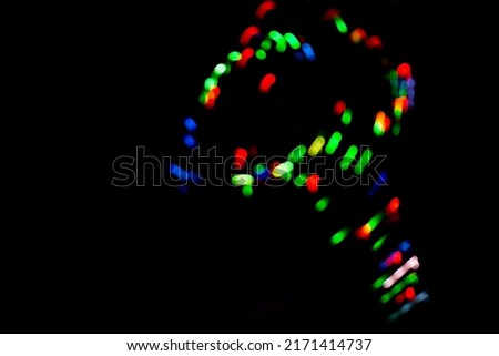 Fashionable style charcoal dark backdrop with soft white glowing in neon light
