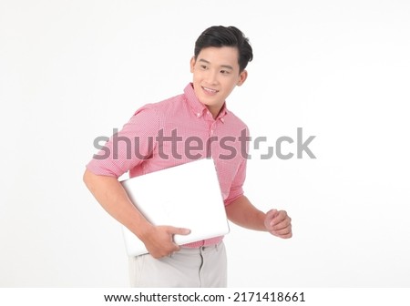 Portrait of a young Asian handsome man in red shirt, hand gesture point to the air to show message, isolated on white background