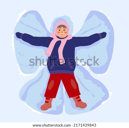 Happy child in snow making angel. Child playing outdoor game on Christmas holidays. Girl in snow. Lying cartoon character. Isolated on white