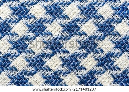 Fabric.Checkered fabric. Checkered pattern on fabric of different colors. Material for clothing Royalty-Free Stock Photo #2171481237