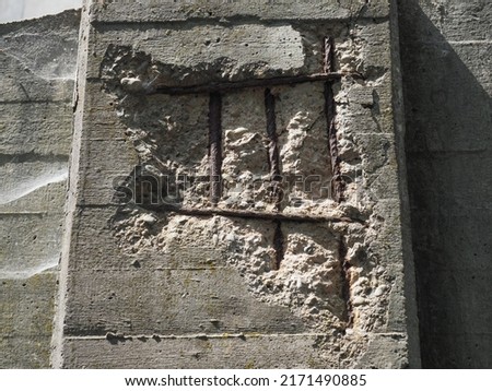 corroded resistance bars in reinforced concrete wall Royalty-Free Stock Photo #2171490885