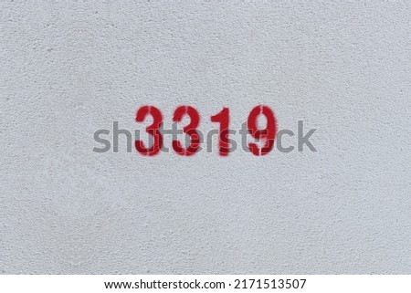 Red Number 3319 on the white wall. Spray paint.
