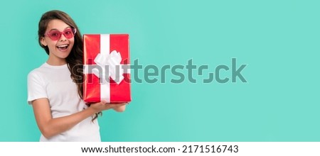 Teenager gift. concept of shopping. sale and discount. surprise for her. Teenager girl with birthday gift, horizontal poster. Banner header with copy space.
