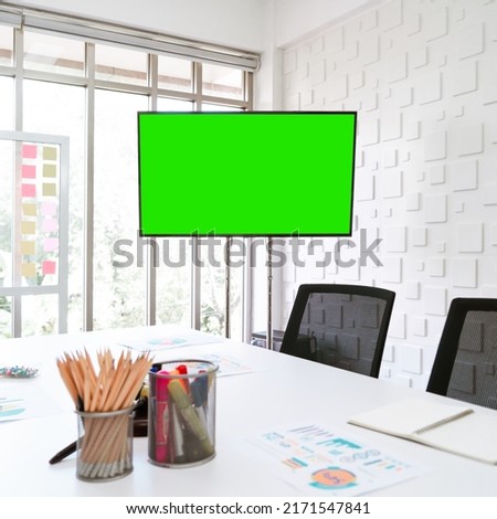 Mock up office meeting display blank green screen.