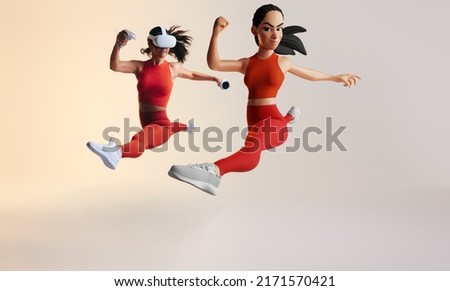 Metaverse workout session. Sporty young woman exploring virtual reality fitness games as a 3D avatar. Athletic young woman running with virtual reality goggles and controllers.