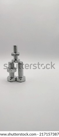 three bolts neatly arranged with a shiny silver color 