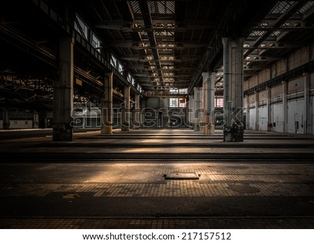 Large industrial hall of a vehicle repair station Royalty-Free Stock Photo #217157512