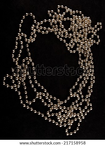 Pearls on  black  background artistic warm  toned photo