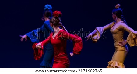 Flamenco dancers in Andalusian costumes Royalty-Free Stock Photo #2171602765