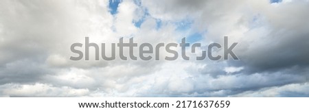 Ornamental clouds. Dramatic sky. Cloudscape. Soft sunlight. Panoramic image, texture, background, graphic resources, design, copy space. Meteorology, weather, climate, heaven, hope, peace concepts