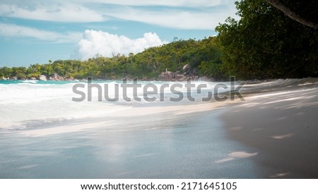 Vacation summer holidays background wallpaper - sunny tropical Caribbean paradise beach with white sand in Seychelles Praslin island Thailand style with palms