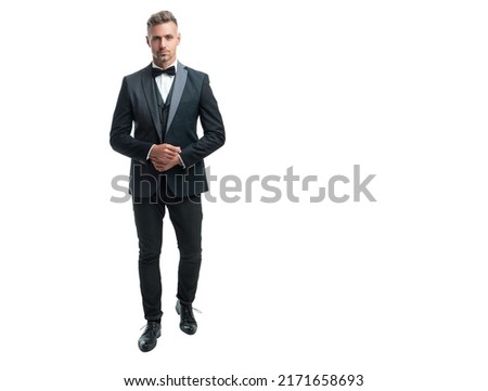 ambitious man bridegroom in rich tux bow isolated on white background. full lentgh Royalty-Free Stock Photo #2171658693