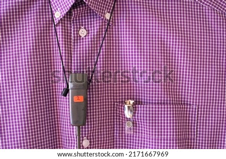 Podcasting concept, vintage recording microphone on a purple shirt, free copy space
