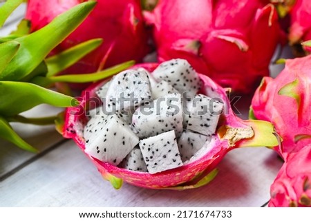 dragon fruit slice on fruit peel with pitahaya background , fresh white dragon fruit tropical in the asian thailand healthy fruit concept