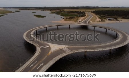 Unusual circular shape of Laguna Garzon Bridge, Uruguay. Aerial shot Royalty-Free Stock Photo #2171675699