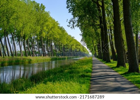 Damme Canal. The canal is located in the province of West Flanders in Belgium. It connects the city of Bruges with the Dutch city of L'Écluse Royalty-Free Stock Photo #2171687289