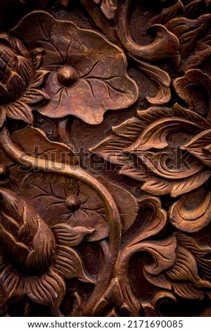 Details of a fine carving art on wooden door