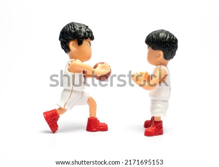 toy basketball player on white background