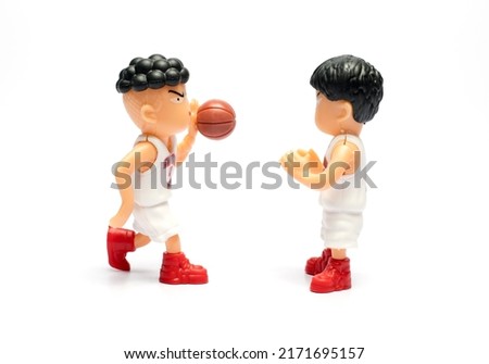 toy basketball player on white background