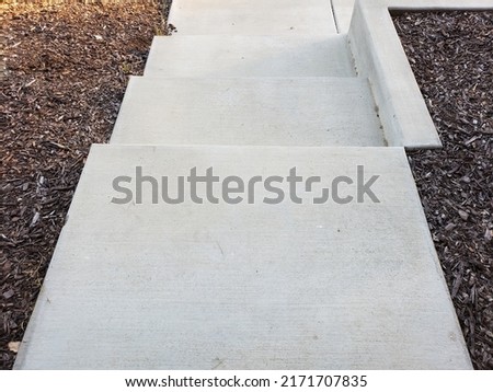 Concrete steps on residential walkway Royalty-Free Stock Photo #2171707835