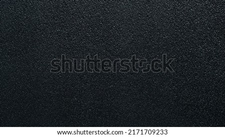Seamless surface of black sponge foam as background, ethylene (eva) vinyl acetate sheet, sandpaper-like fine texture.