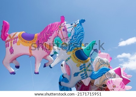 Set of children's balloons with horses and sharks