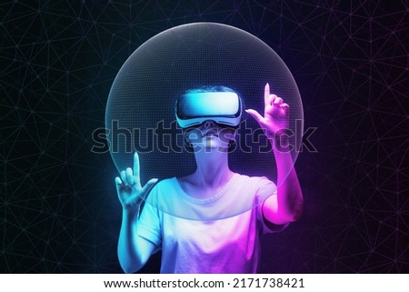 Metaverse and 3D simulation. Portrait of young woman in VR glasses creates mesh sphere. Dark background with neon abstracts. The concept of virtual reality and futurism. Royalty-Free Stock Photo #2171738421