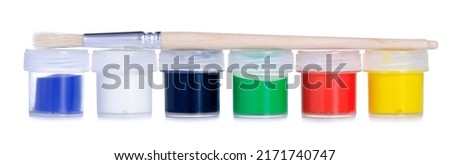 Jars gouache paints with paint brush on white background isolation