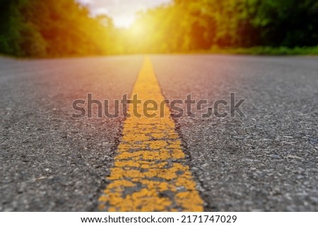 yellow line on asphalt road at country side .