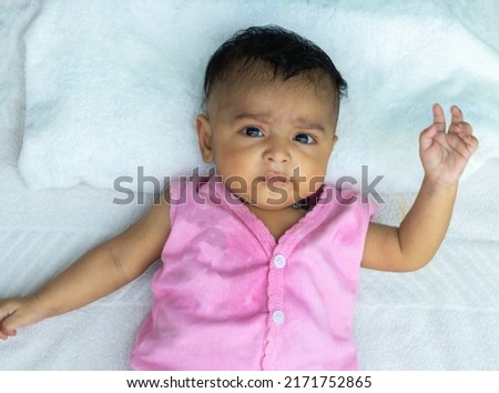 portrait of Indian toddler baby boy on bed