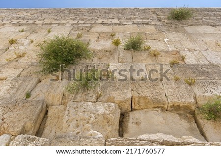 The Western Wall in the Jewish Quarter of the Old City of Jerusalem Royalty-Free Stock Photo #2171760577