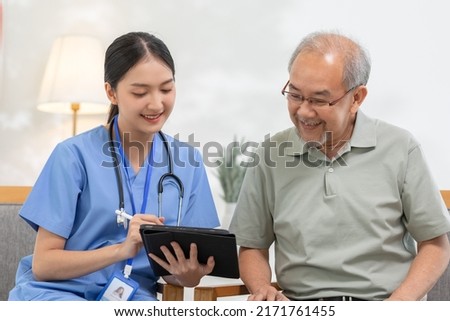 Doctor works in hospital or patient home consults to patient explains health care symptoms and help senior man, give medicines. Writing down diagnosed and symptoms, elderly care, health care concept